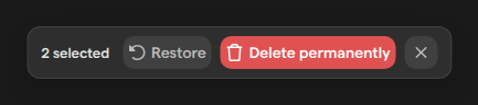 The Trash page’s selection toolbar with two items selected, showing the Restore and Delete permanently buttons.