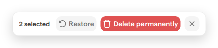 The Trash page’s selection toolbar with two items selected, showing the Restore and Delete permanently buttons.