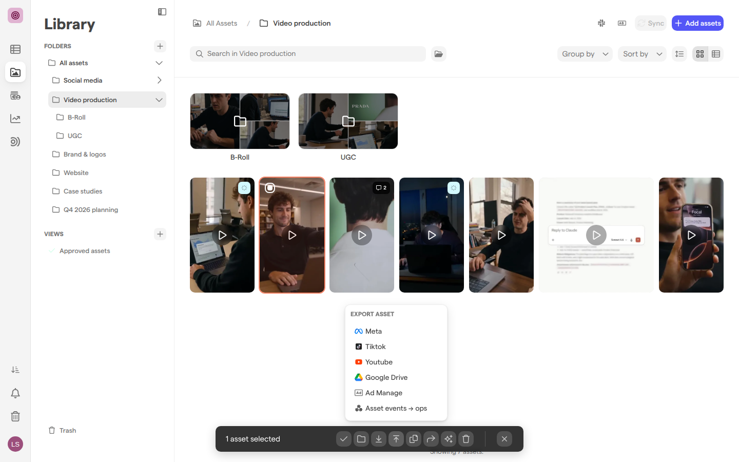 A library folder with one video selected and the Export asset menu open, listing Meta, Tiktok, Youtube, Google Drive, Ad Manage and a webhook, with the Slack icon and the Sync button in the folder header.