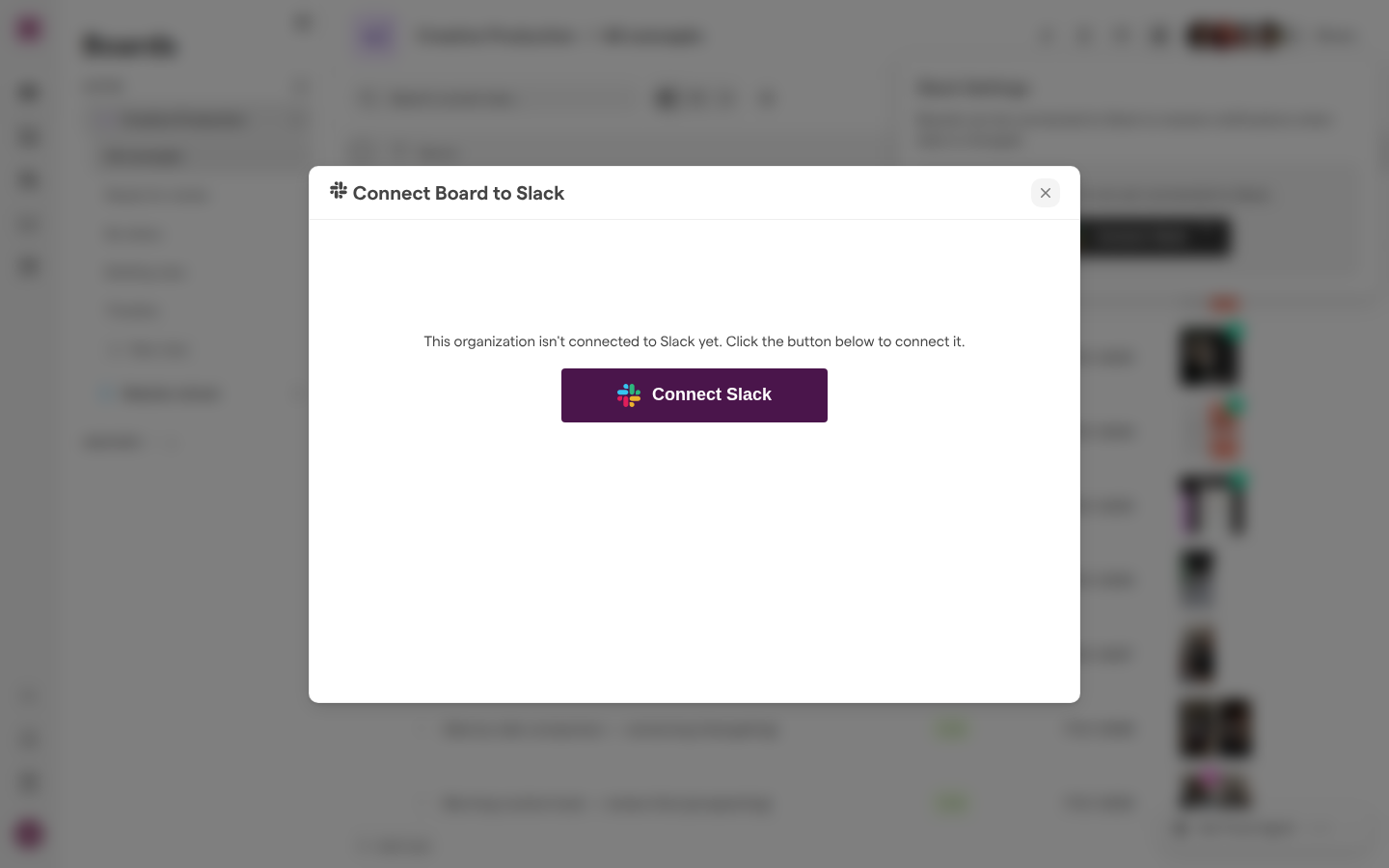 The Connect Board to Slack dialog over a board, saying the organization isn’t connected to Slack yet, with a Connect Slack button.