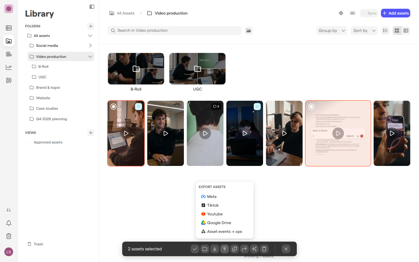 The Video production folder with two videos selected and the Export assets menu open, listing Meta, Tiktok, Youtube, Google Drive and a webhook.
