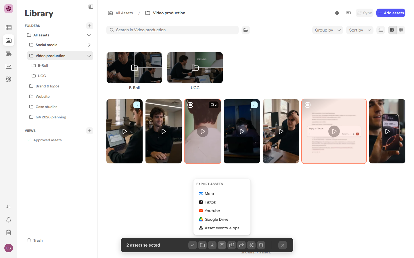 The Video production folder with two videos selected and the Export assets menu open, listing Meta, Tiktok, Youtube, Google Drive and a webhook.