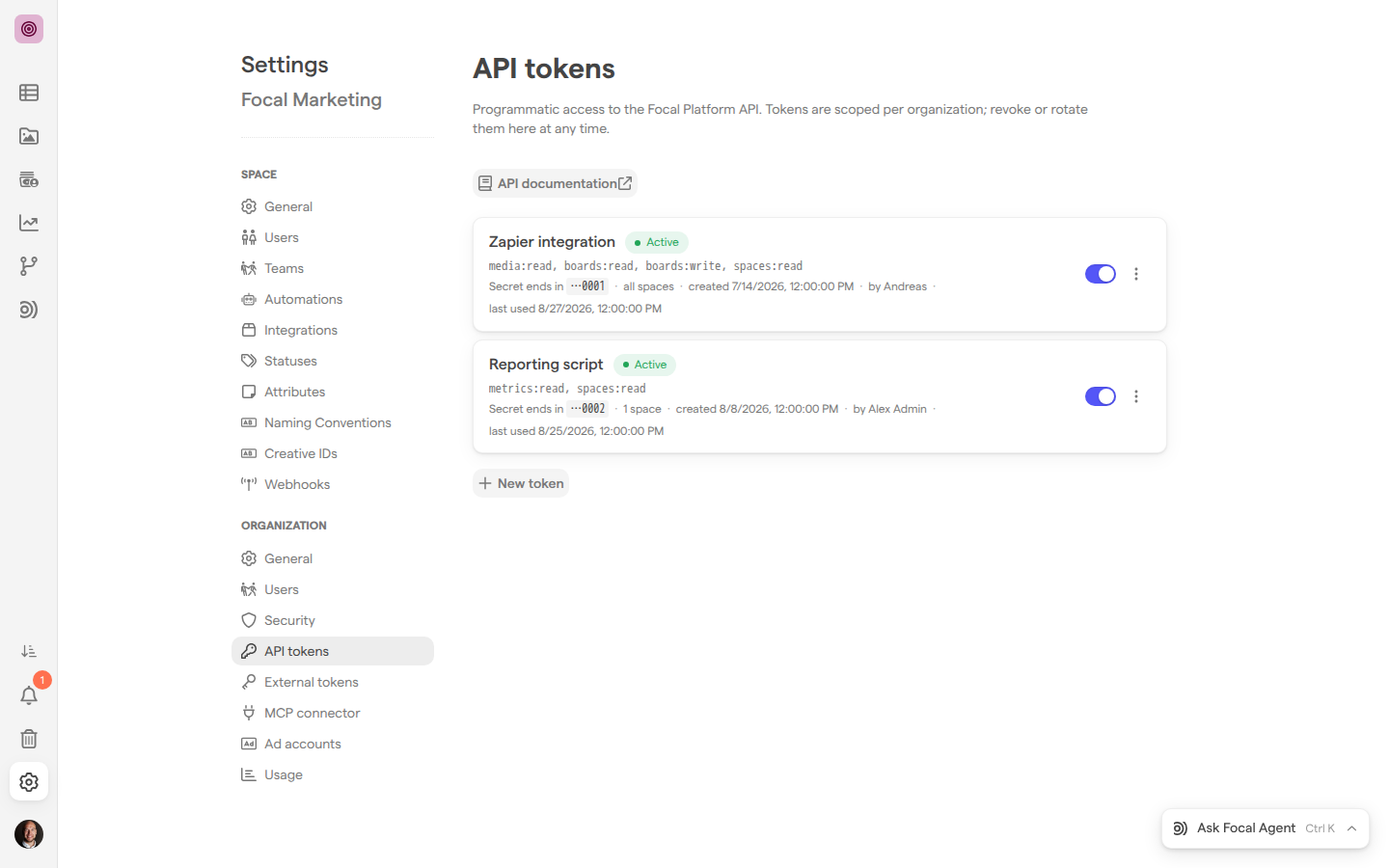 The API tokens page of organization settings, listing two tokens with their status, scopes, space access and dates.