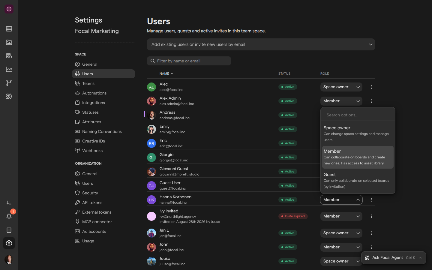 Space Settings on the Users page, with the role picker open on a member’s entry listing Space owner, Member and Guest with their descriptions.