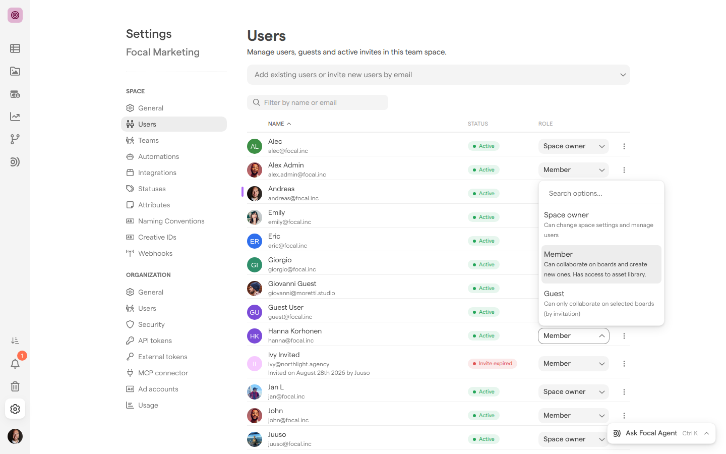 Space Settings on the Users page, with the role picker open on a member’s entry listing Space owner, Member and Guest with their descriptions.
