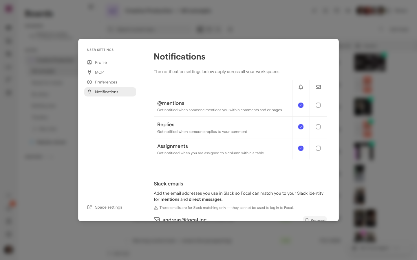 The Notifications page of User Settings, with In App selected and Email cleared for @mentions, Replies and Assignments, and the Slack emails list below.