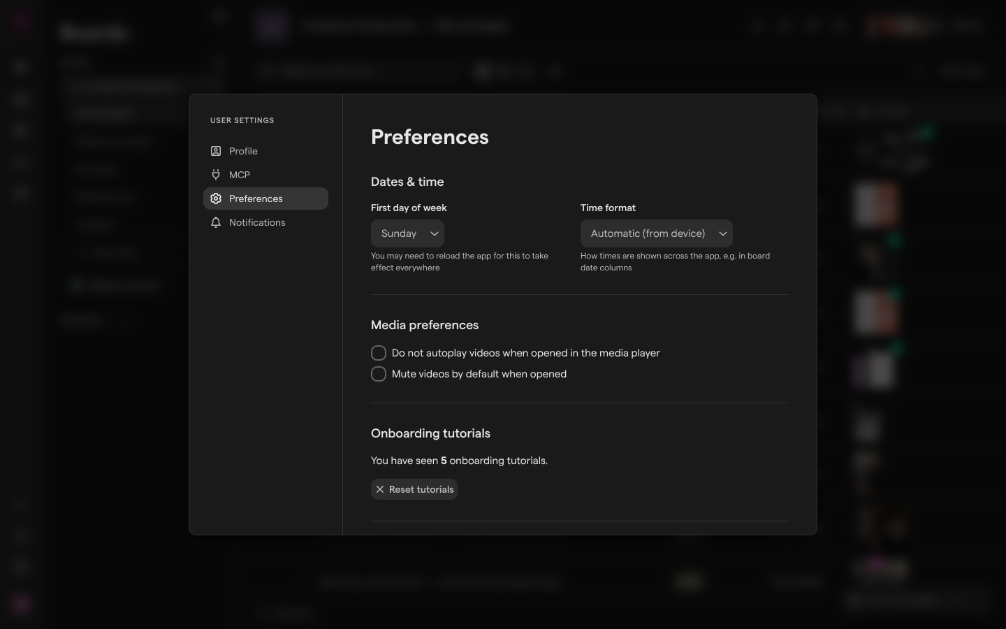 The Preferences page of User Settings, with Dates & time, Media preferences and Onboarding tutorials, open over a board.