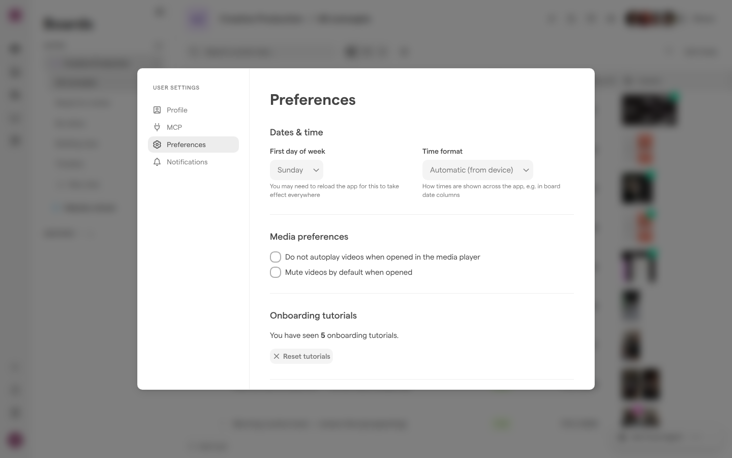 The Preferences page of User Settings, with Dates & time, Media preferences and Onboarding tutorials, open over a board.